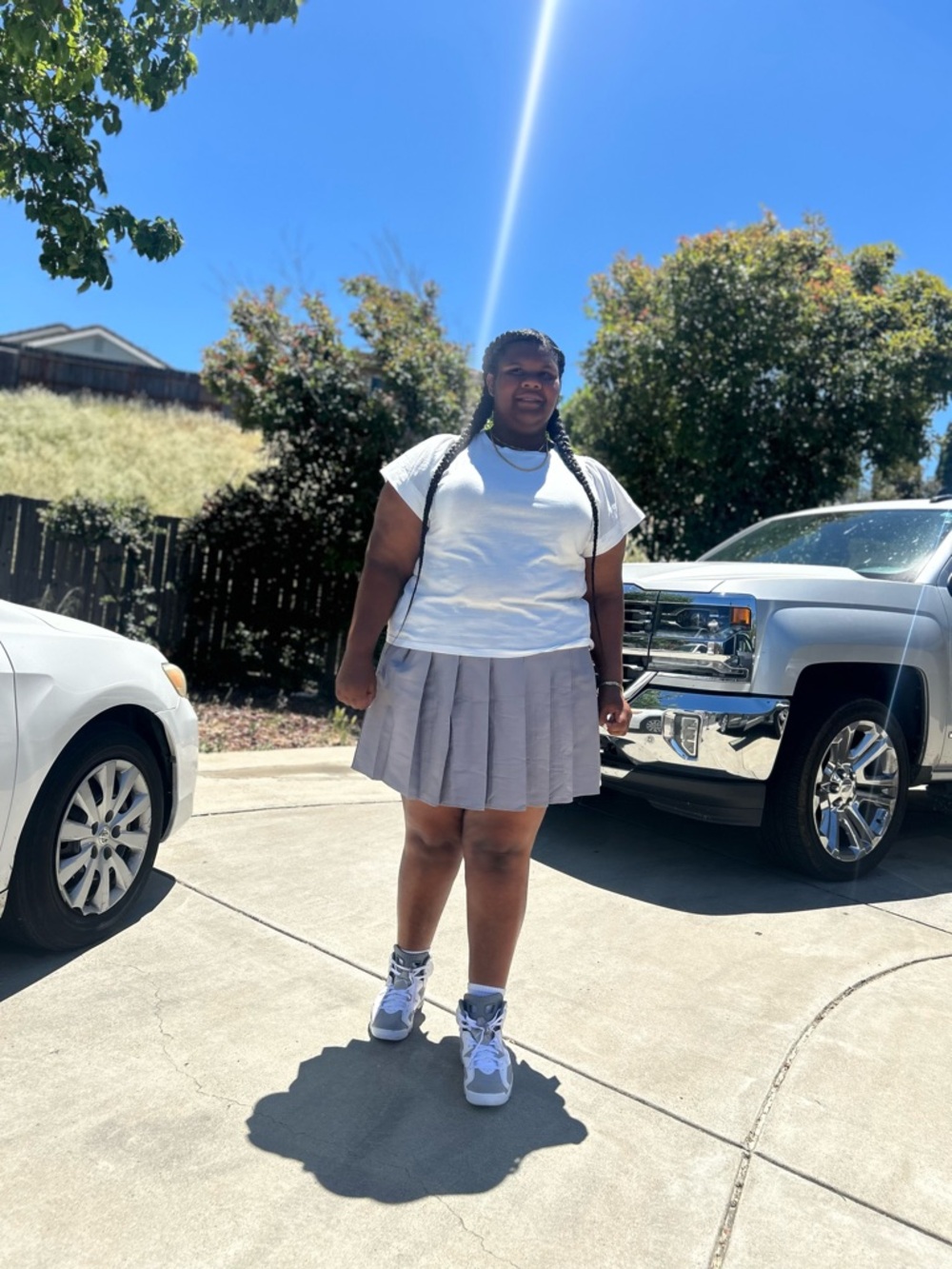 Casual White Tee with Light Gray Pleated Skirt